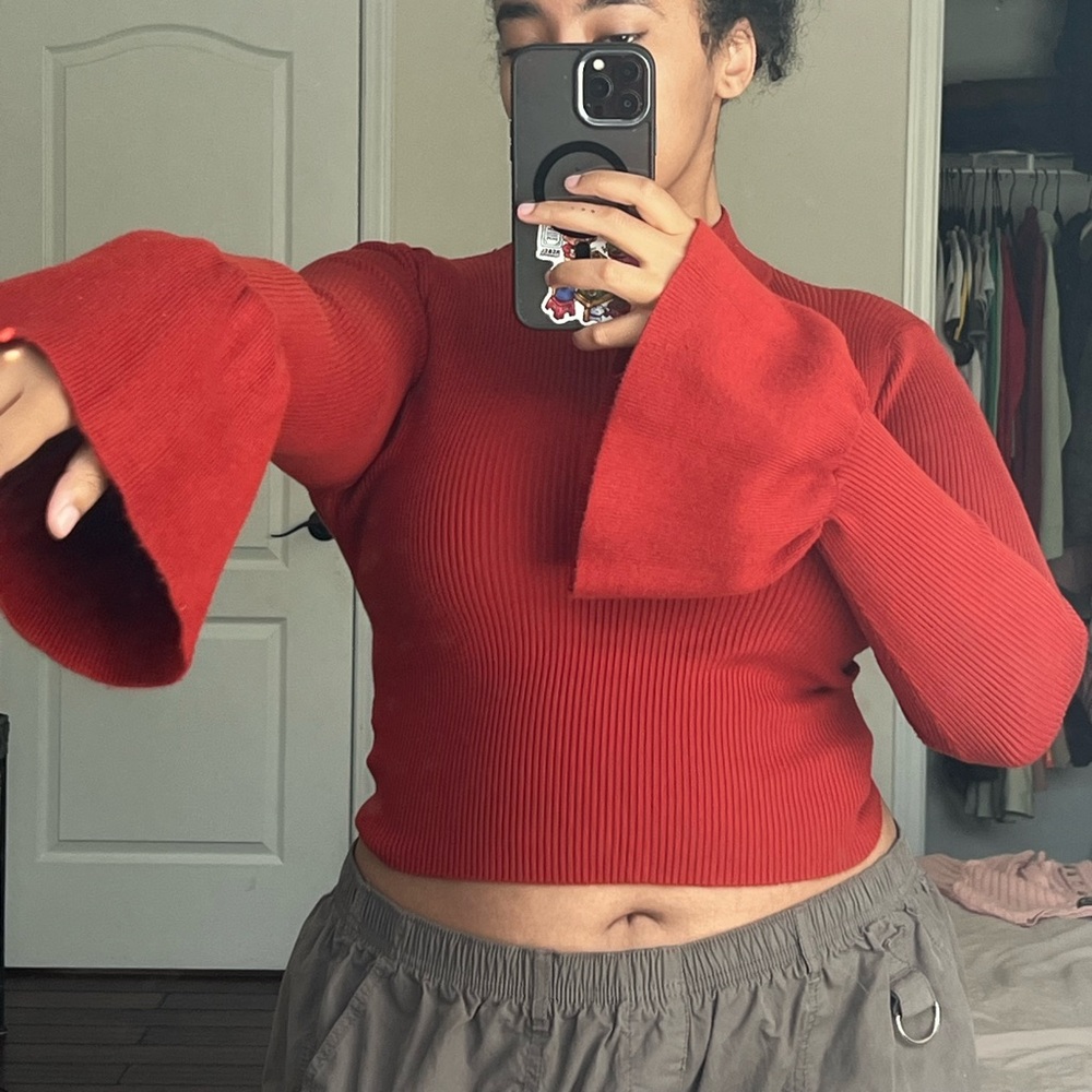 sweater crop with flared sleeves.